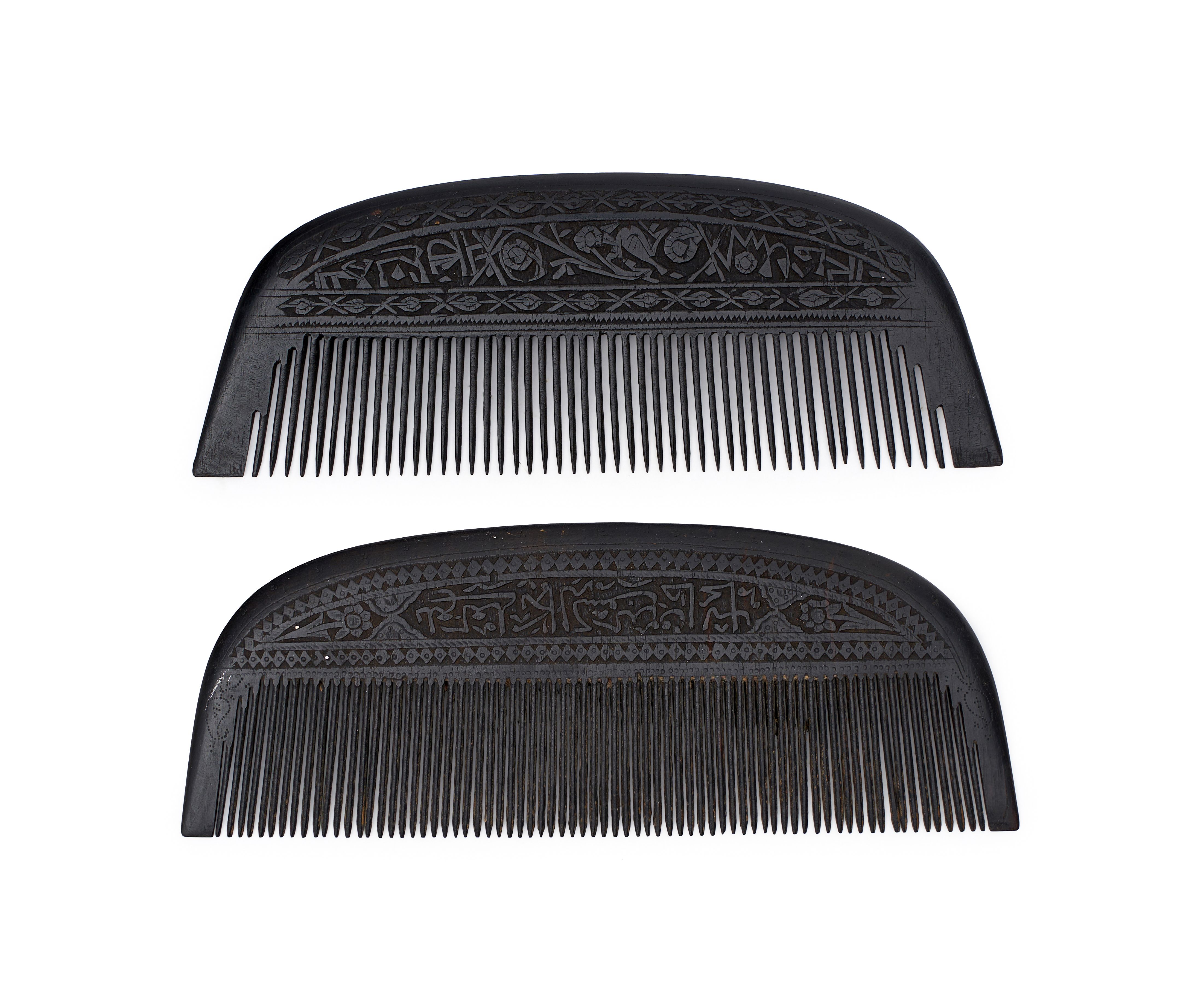 A PAIR OF INSCRIBED CALLIGRAPHIC WOODEN COMBS, SAFAVID, 17TH CENTURY, IRAN