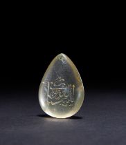 A GOLDEN CALLIGRAPIC INSCRIBED ROCK CRYSTAL AMULET, 19TH CENTURY, PERSIA