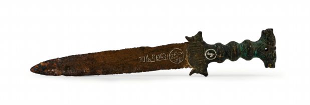 AN EARLY ISLAMIC BRONZE AND SILVER INLAID INSCRIBED DAGGER