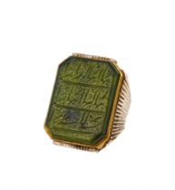 A CALLIGRAPHIC INSCRIBED SPINACH JADE RING, 19TH CENTURY, PERSIA