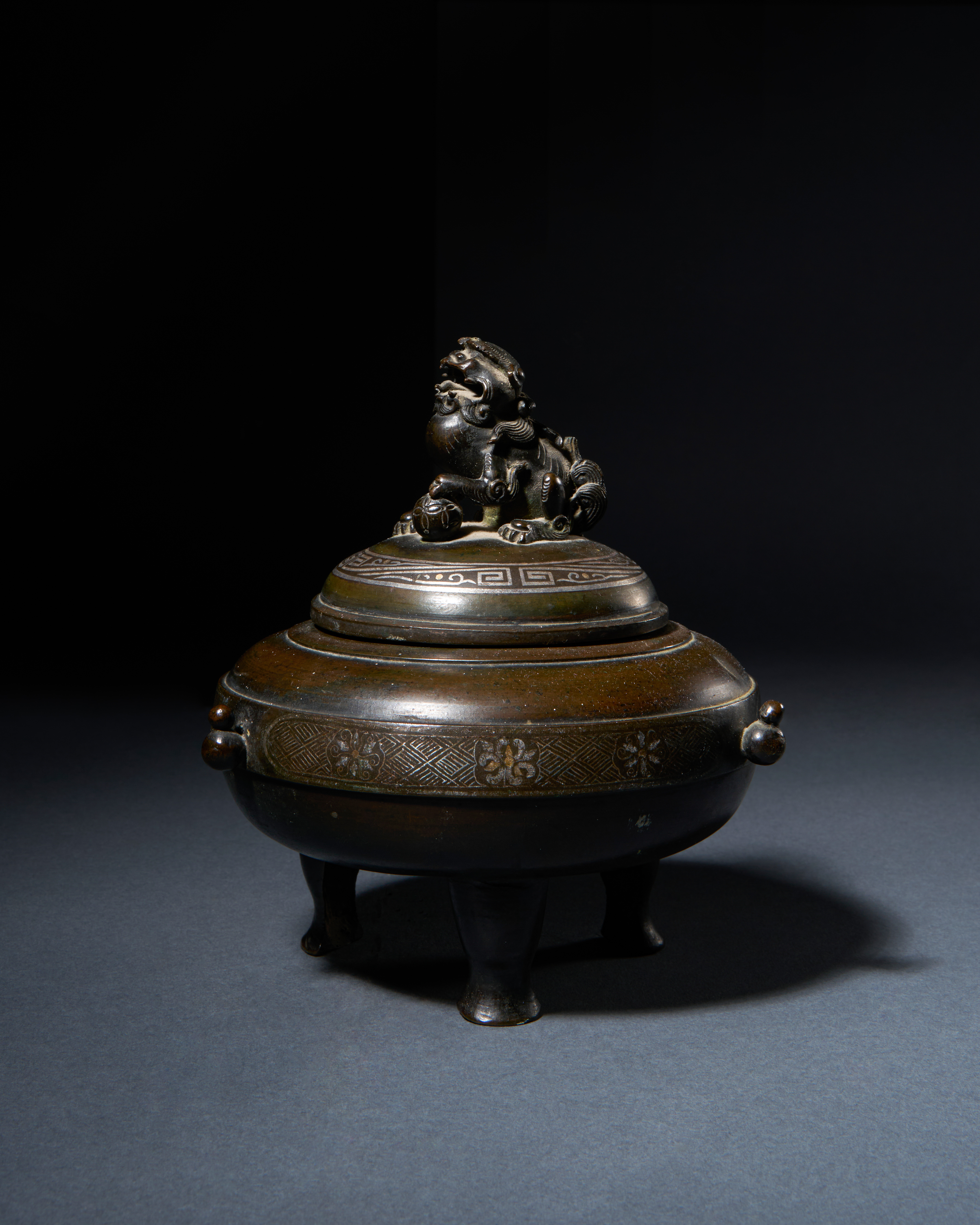 A SILVER INLAID BRONZE QILIN CENSER, QING DYNASTY (1644-1911)