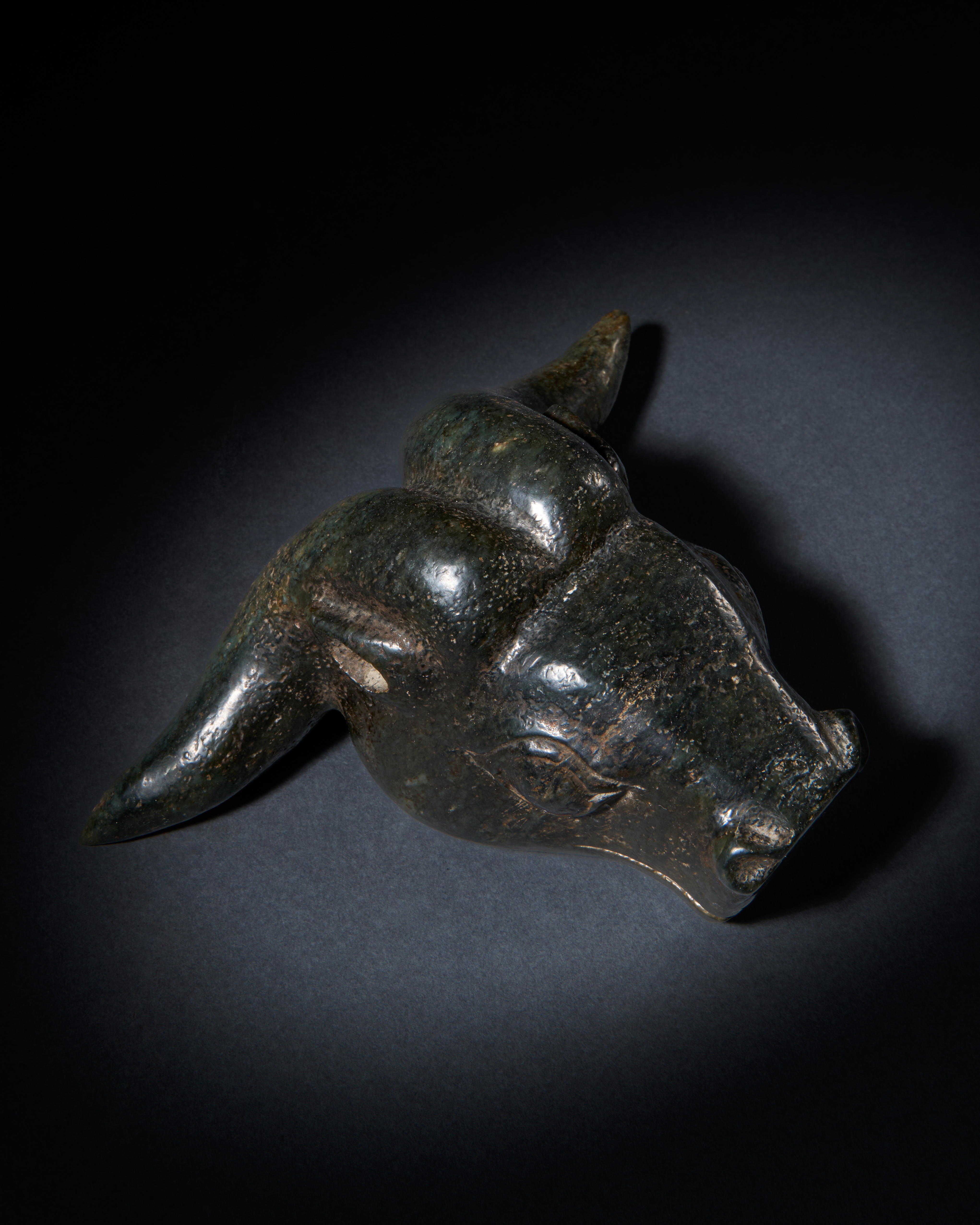 A TIBETAN STONE WEIGHT IN THE FORM OF A BULL