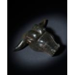 A TIBETAN STONE WEIGHT IN THE FORM OF A BULL