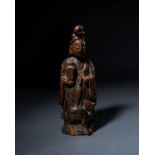 A WOODEN FIGURE OF A GUANYIN