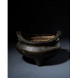 A LARGE CHINESE BRONZE TRIPOD CENSER, QING DYNASTY (1644-1911)