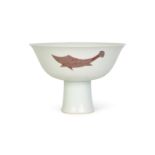 A MING-STYLE COPPER-RED 'THREE FISH' STEM BOWL, KANGXI PERIOD (1662-1722)