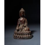 A BRONZE BUDDHA