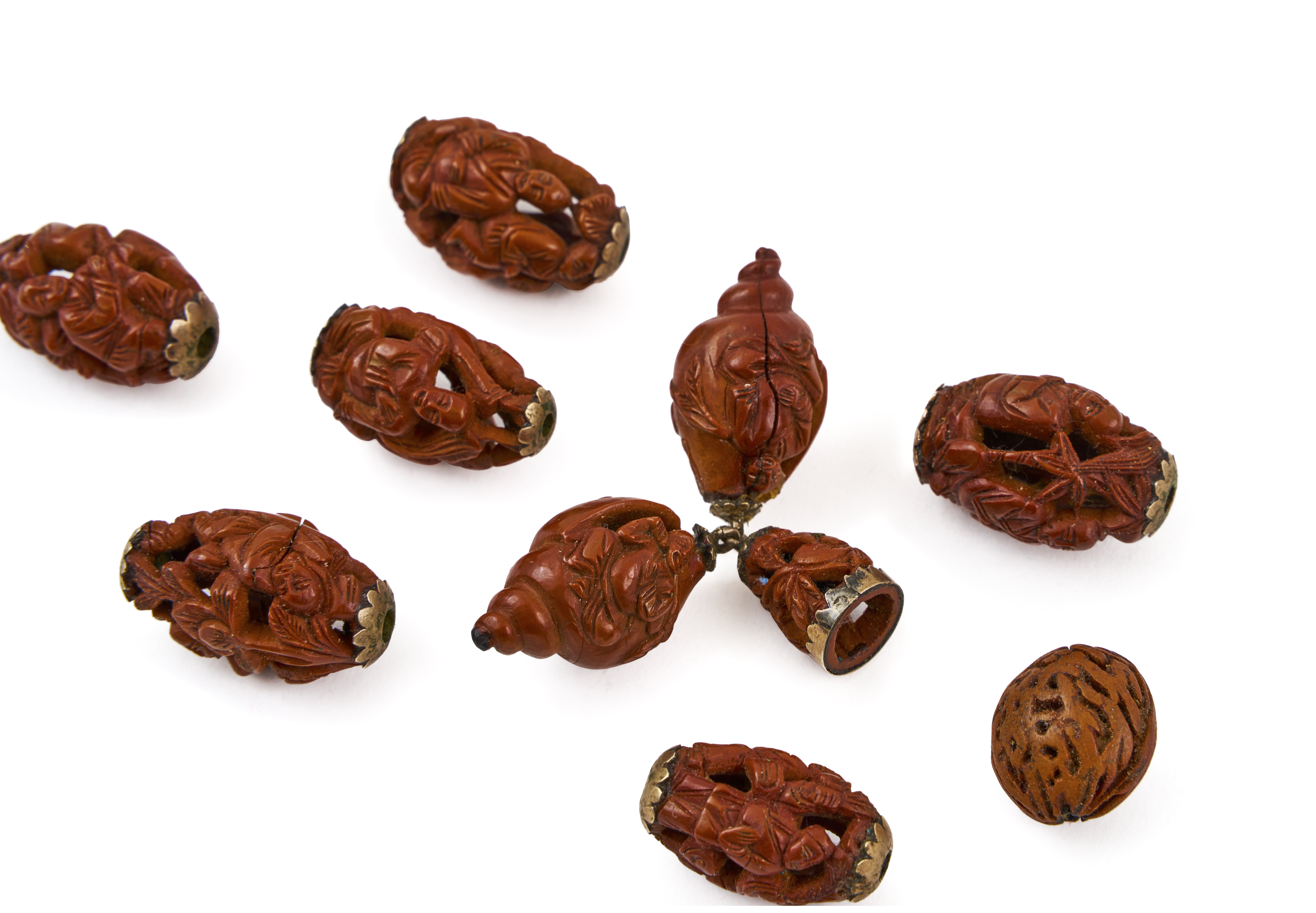 ASSORTMENT OF CHINESE CARVED NUTS, QING DYNASTY (1644-1911)
