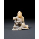 A CARVED SOAPSTONE FIGURE OF A SEATED LUOHAN, 18TH CENTURY