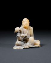 A CARVED SOAPSTONE FIGURE OF A SEATED LUOHAN, 18TH CENTURY