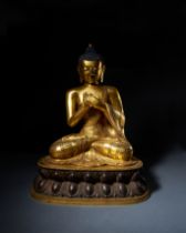 A LARGE GILT COPPER ALLOY FIGURE OF AMOGHASIDDHI