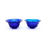 A PAIR OF CARVED BLUE GLASS BOWLS CHINA, QING DYNASTY (1644-1911)