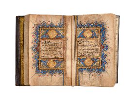 AN EXCEPTIONAL ILLUMINATED COMPLETE MINIATURE SAFAVID QURAN, EARLY SAFAVID, IRAN DATED 10TH SHAWWAL