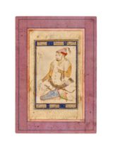 A MINIATURE PAINTING OF A SEATED WARRIOR, IN THE MANNER OF SAFAVID, PROBABLY ZAND, 18TH CENTURY