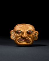 A GOLD MOCHE OF A HUMAN HEAD WITH SHELL & STONE INLAY, LOMA NEGRA, VICUS-MOCHE, CIRCA 200-500 A.D.