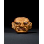 A GOLD MOCHE OF A HUMAN HEAD WITH SHELL & STONE INLAY, LOMA NEGRA, VICUS-MOCHE, CIRCA 200-500 A.D.