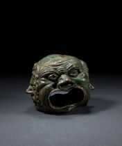 A RARE ROMAN BRONZE HEAD DEPICTING FOUR THEATRICAL MASKS, CIRCA 1ST CENTURY A.D.