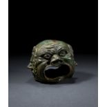 A RARE ROMAN BRONZE HEAD DEPICTING FOUR THEATRICAL MASKS, CIRCA 1ST CENTURY A.D.