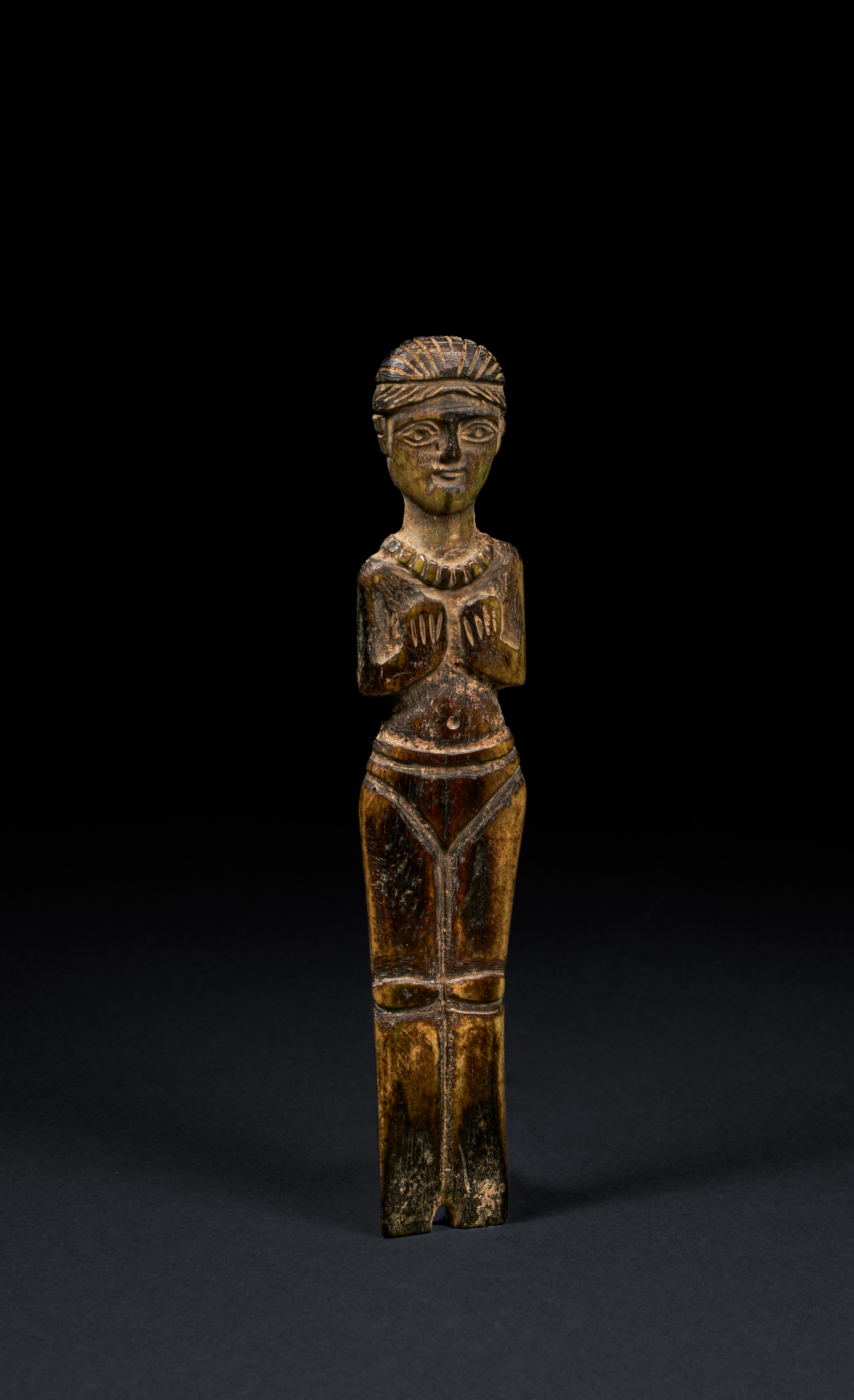 A ROMANO-EGYPTIAN BONE FEMALE FIGURE 3RD-4TH CENTURY A.D.