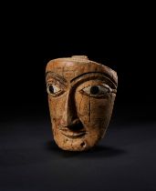 AN EGYPTIAN PAINTED WOOD FACE LATE NEW KINGDOM TO THIRD INTERMEDIATE PERIOD, 19TH-21ST DYNASTY, 1295