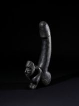 A BLACK STONE PHALLUS, PROBABLY OCEANIC