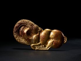 AN ACHAEMENID GOLD APPLIQUE OF A RECUMBANT RAM, CIRCA LATE 6TH-EARLY 5TH CENTURY B.C.