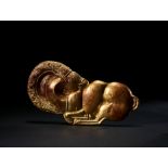 AN ACHAEMENID GOLD APPLIQUE OF A RECUMBANT RAM, CIRCA LATE 6TH-EARLY 5TH CENTURY B.C.