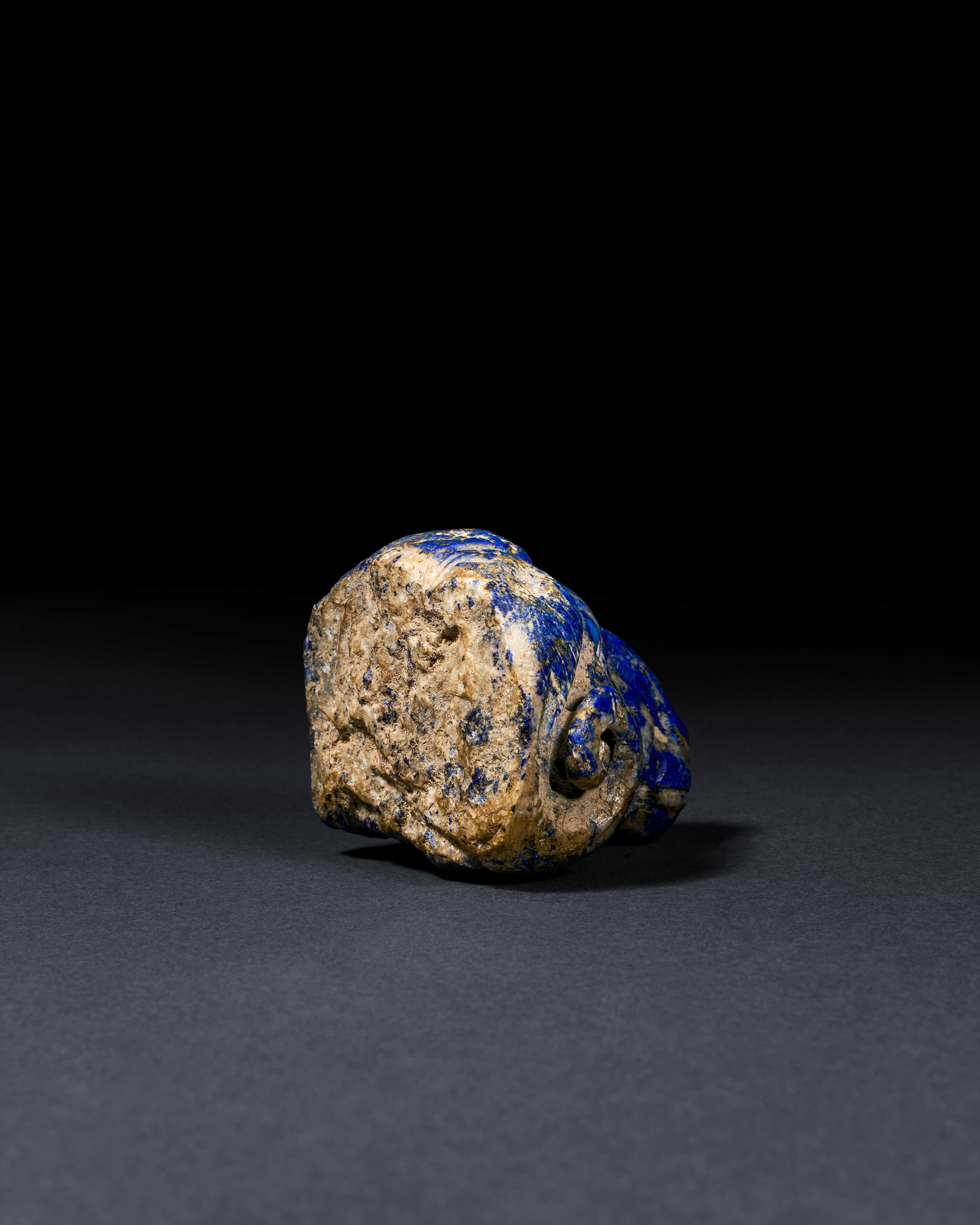 A RARE ACHAEMENID LAPIS LAZULI "RAM" HEAD STAFF ATTACHMENT, CIRCA 6TH CENTURY B.C. - Image 3 of 3