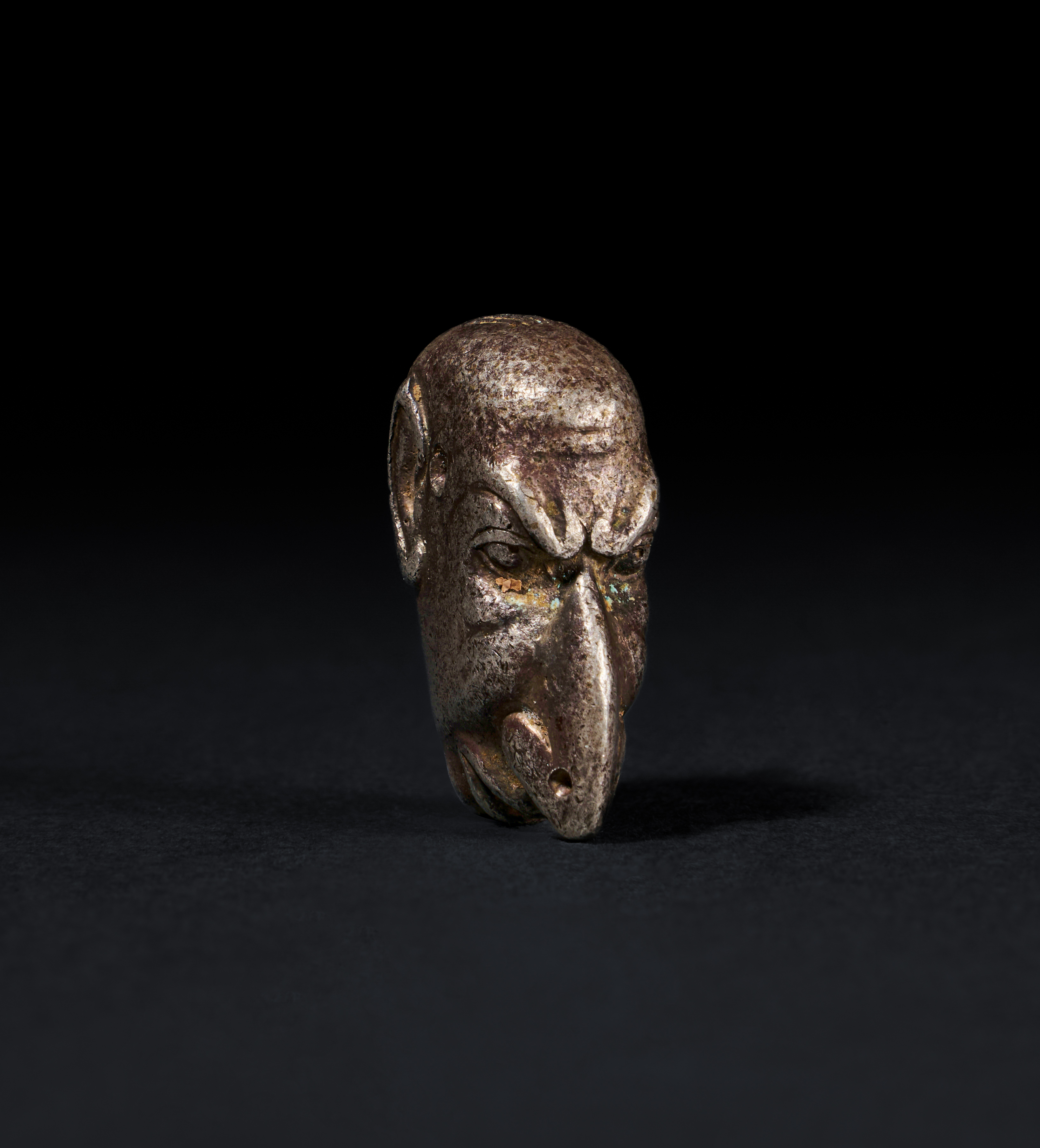 A ROMAN SOLID SILVER AMULET OF A "GROTESK" FACE, CIRCA 1ST-2ND CENTURY A.D. - Image 2 of 2