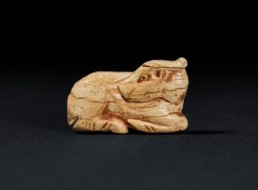 A MESOPOTAMIAN BONE ANIMAL AMULET, JEMDET NASR, CIRCA 3300-2900 B.C.