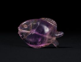 A ROMANO-EGYPTIAN AMETHYST FISH AMULET, CIRCA 1ST CENTURY B.C/A.D.