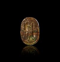 AN EGYPTIAN INSCRIBED STONE HEART SCARAB