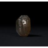 AN AGATE BABYLONIAN STAMP SEAL DEPICTING A RULER, CIRCA 2ND MILLENNIUM B.C