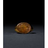 A ROMAN GOLD & CARNELIAN INTAGLIO RING, CIRCA 1ST CENTURY A.D.