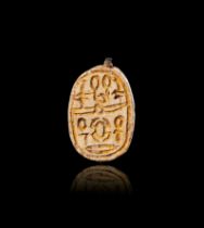 AN EGYPTIAN INSCRIBED STONE HEART SCARAB