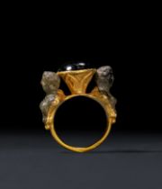 THREE EGYPTIAN A RARE HELLENISTIC HITTITE & GARNET RING, CIRCA 3RD CENTURY B.C.