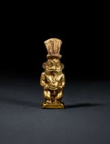 AN EGYPTIAN GOLD BES AMULET NEW KINGDOM TO THIRD INTERMEDIATE PERIOD, DYNASTY XVII-XXII