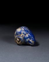 A RARE ACHAEMENID LAPIS LAZULI "RAM" HEAD STAFF ATTACHMENT, CIRCA 6TH CENTURY B.C.