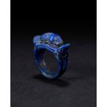 AN EGYPTIAN LAPIS LAZULI WINGED SCARAB RING