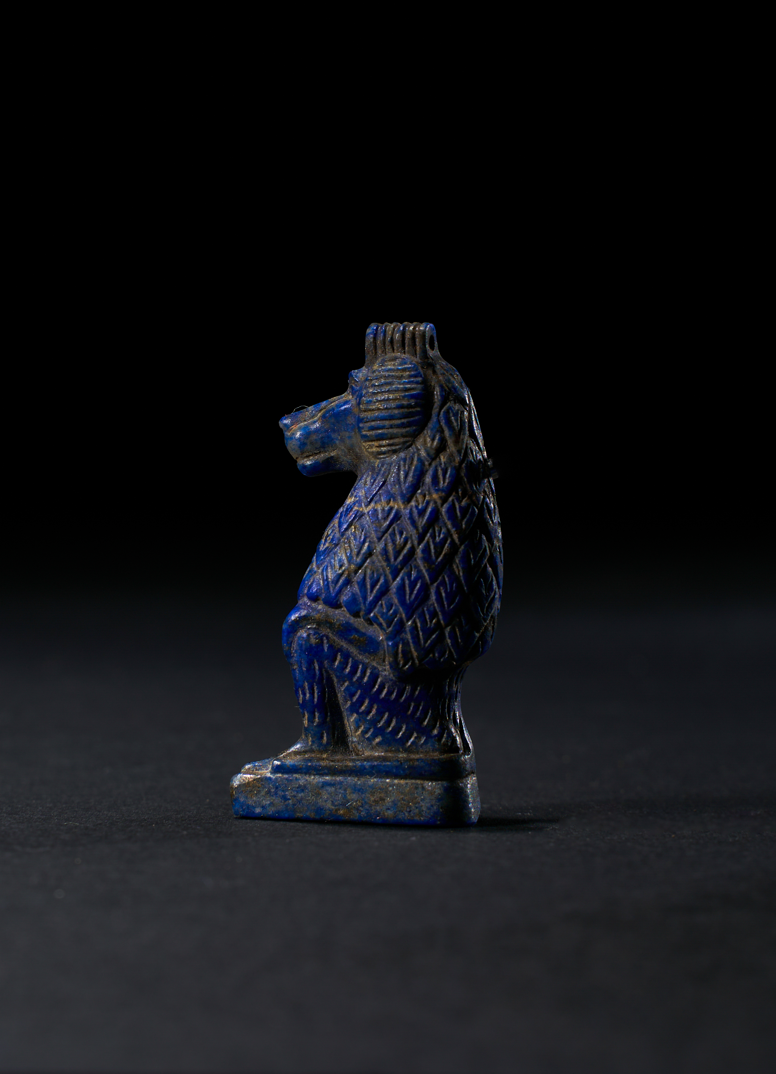 AN EGYPTIAN LAPIS LAZULI BABOON AMULET, LATE PERIOD, 664-332 B.C.