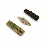 THREE EGYPTIAN CROCODILE AMULETS, LATE PERIOD TO ROMAN PERIOD, CIRCA 6TH CENTURY B.C.-2ND CENTURY A.