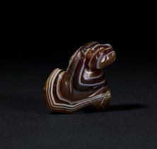 AN ELAMITE BANDED AGATE FELINE IRAN, CIRCA 1200 B.C.