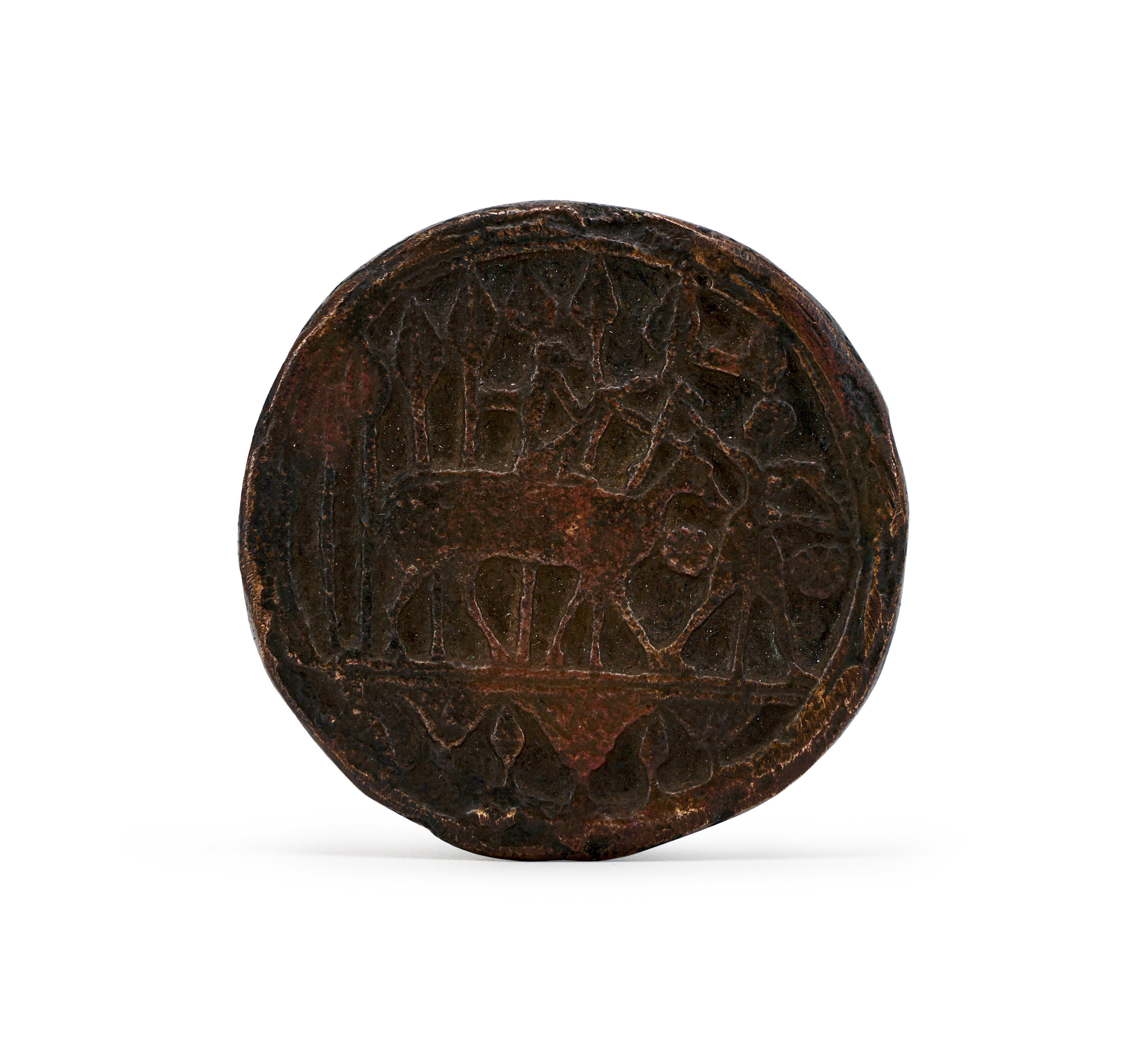 AN EGYPTIAN BRONZE DISC AMULET PTOLEMAIC-ROMAN PERIOD, CIRCA 3RD CENTURY B.C.-2ND CENTURY A.D.