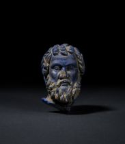 A HIGHLY RARE BLUE GLASS HEAD BUST OF SVORONOS, PHILOSOPHER OF ANTIKYTHERA, HELLENISTIC PERIOD, CIRC