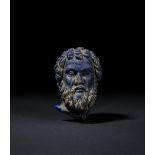 A HIGHLY RARE BLUE GLASS HEAD BUST OF SVORONOS, PHILOSOPHER OF ANTIKYTHERA, HELLENISTIC PERIOD, CIRC