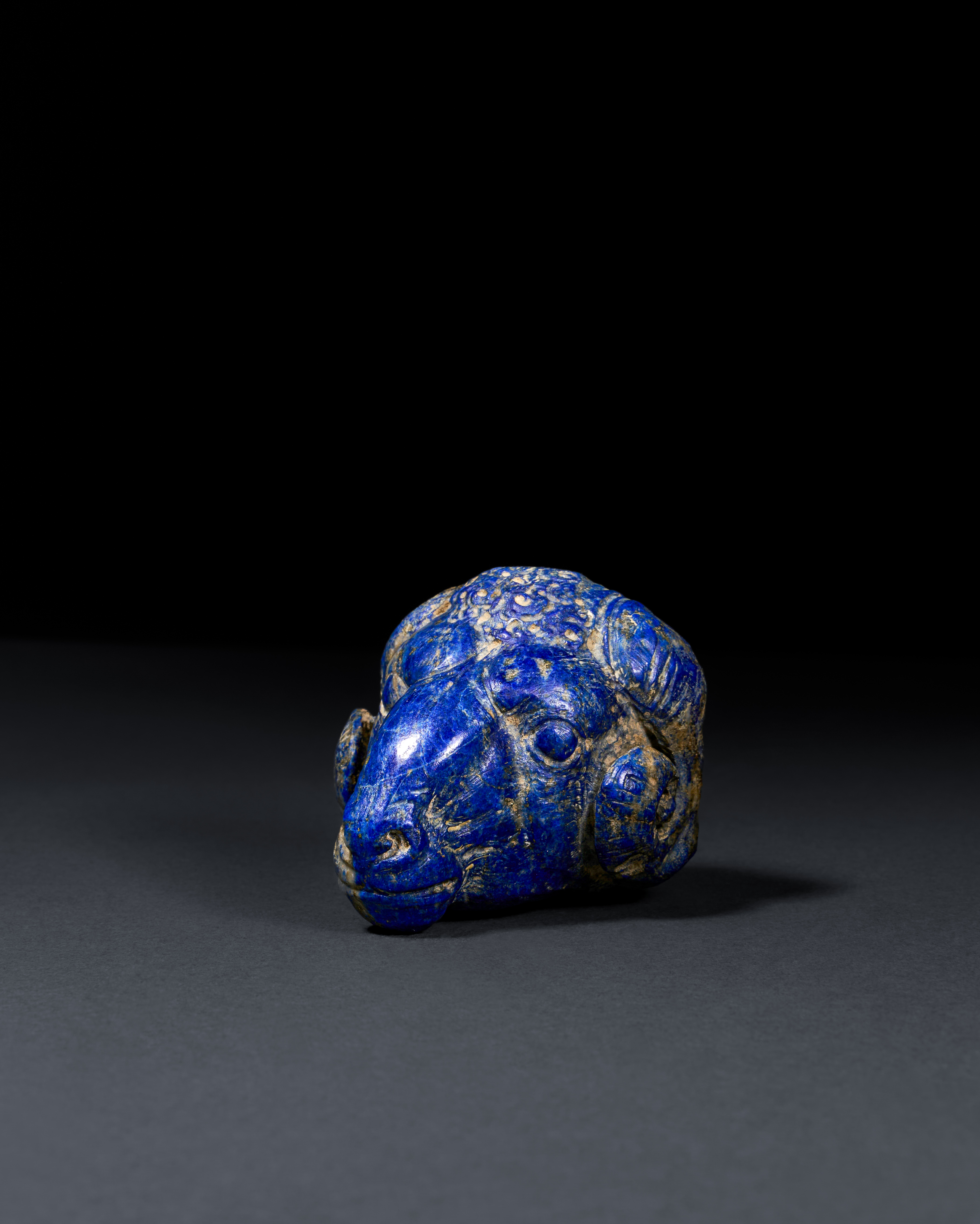 A RARE ACHAEMENID LAPIS LAZULI "RAM" HEAD STAFF ATTACHMENT, CIRCA 6TH CENTURY B.C. - Image 2 of 3