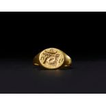 A GREEK INSCRIBED GOLD BULL RING, CIRCA 3RD CENTURY A.D.