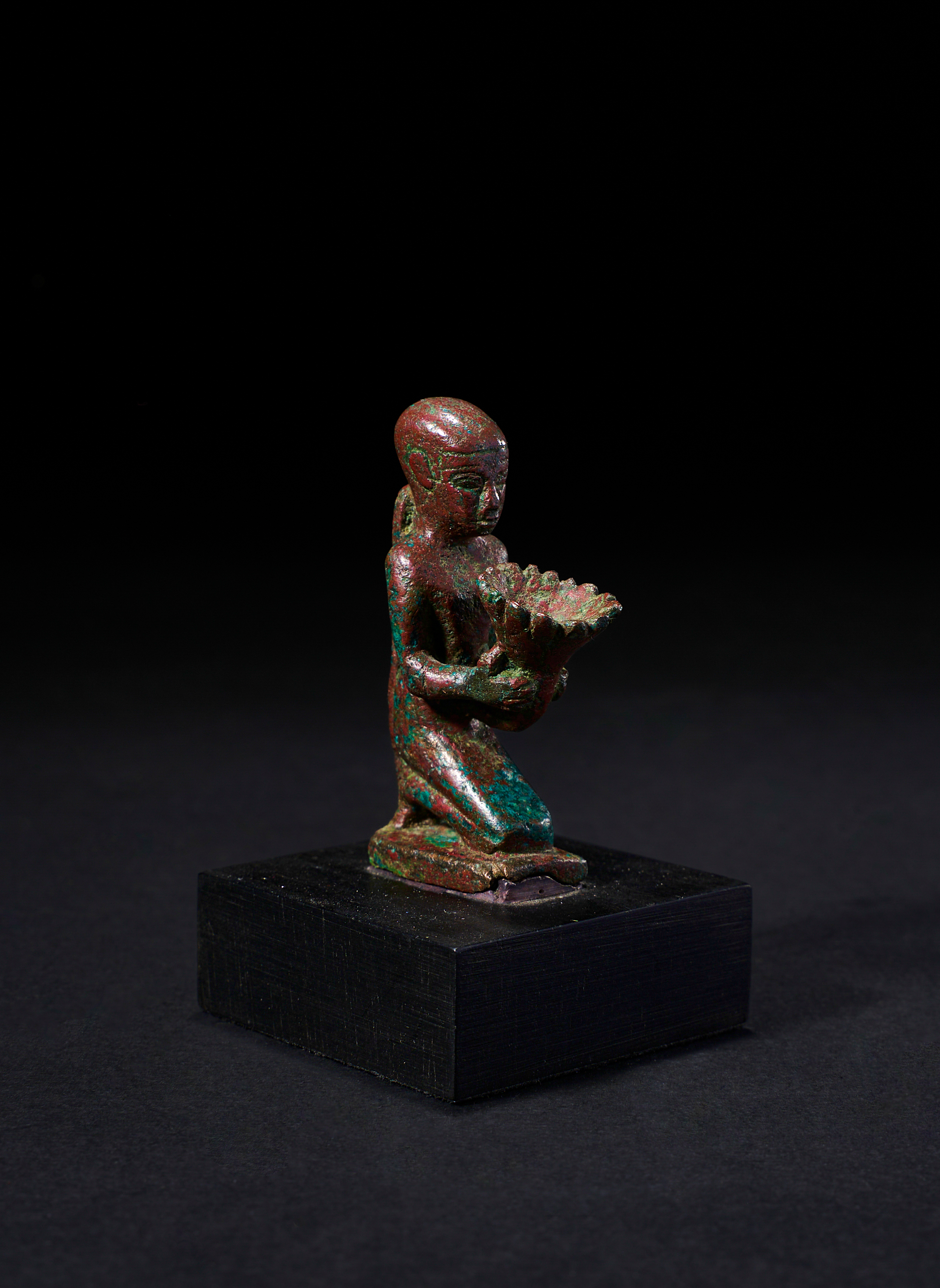 AN EGYPTIAN BRONZE FIGURE OF A PHARAOH DELIVERING A GIFT, PTOLEMAIC PERIOD, 304-30 B.C. - Image 2 of 2