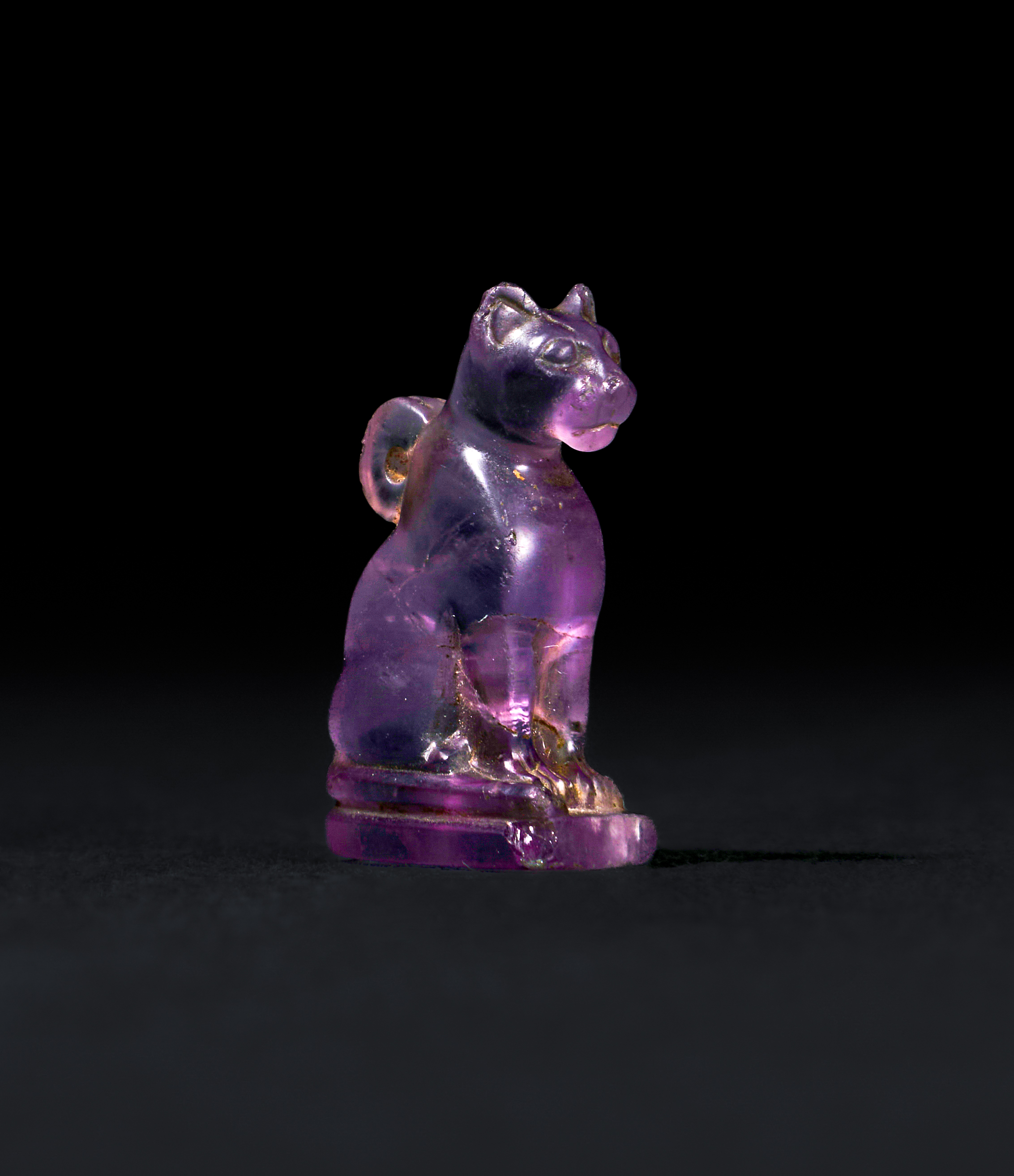 AN EGYPTIAN AMETHYST CAT AMULET LATE PERIOD TO PTOLEMAIC PERIOD, 664-30 B.C.