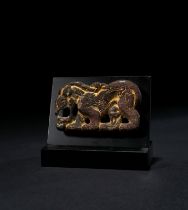 A GILT BRONZE ‘WOLF’ BELT PLAQUE NORTHWEST CHINA, 4TH CENTURY BC